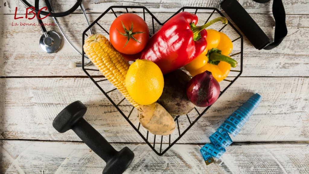 A heart‑shaped basket overflowing with fresh vegetables, a lemon and an ear of corn, surrounded by health‑related items. The colorful scene symbolizes the harmony of nutritious food, self‑love and well‑being.