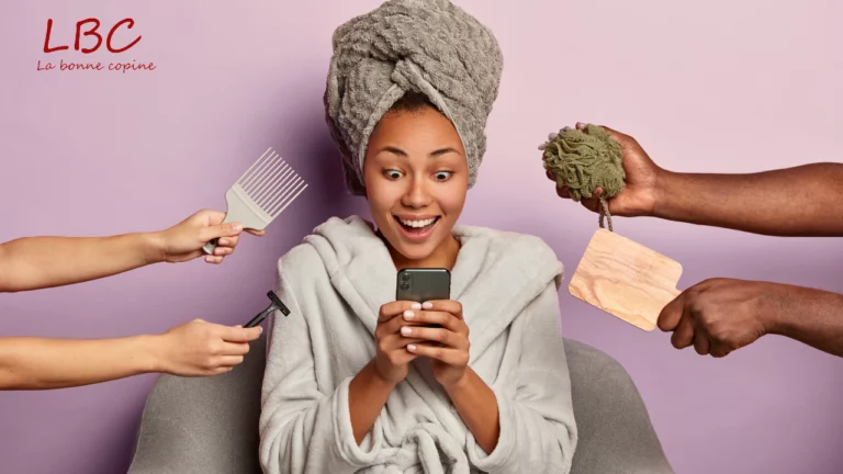 A smiling woman in a bathrobe, towel around her head, consults her phone while hands hand her hairdressing accessories and hair care products | labonnecopine.com/en