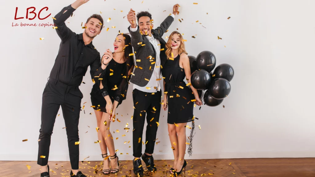 Friends gather in a festive setting surrounded by golden confetti and dark balloons, capturing the joy of shared celebration and the art of renewing treasured moments together.