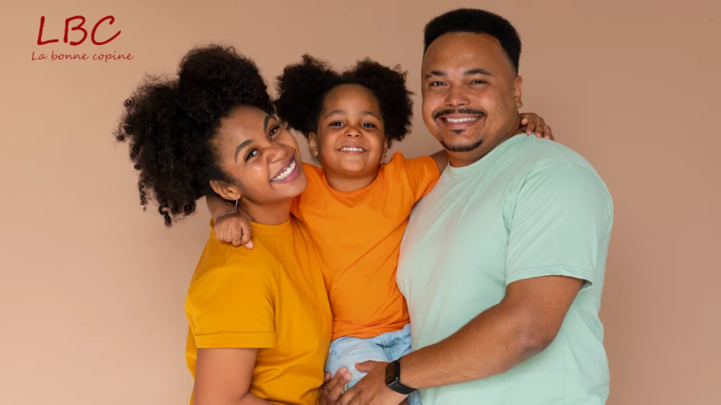 Smiling blended family: woman, man and child tenderly embracing on pastel beige background | labonnecopine.com/en 